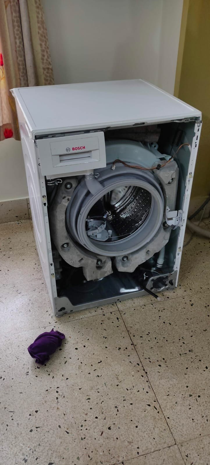 Front panel off and the tub exposed, ready for a new drum and bearings.